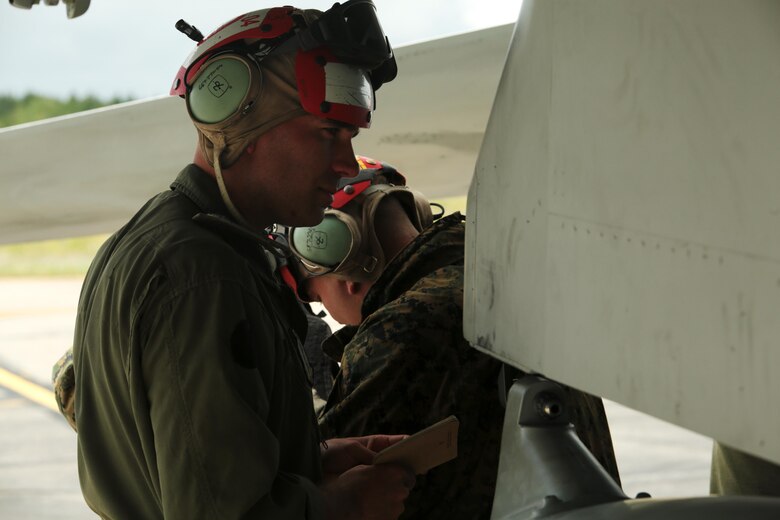 U.S. Marine Corps Sgt. Malcolm Cappelle, a quality assurance safety observer with Marine Fighter Attack Squadron (VMFA) 314, stationed at Marine Corps Air Station Miramar, California, and forward deployed to MCAS Iwakuni, Japan, inspects the installation of a CATM 9X training missile during exercise Red Flag-Alaska 16-2 at Eielson Air Force Base, Alaska, June 16, 2016. Cappelle’s team carried and secured ordnance on the squadron’s F/A-18C Hornet fighter jets in support of exercise Red Flag-Alaska 16-2. (U.S. Marine Corps photo by Lance Cpl. Donato Maffin/Released)
