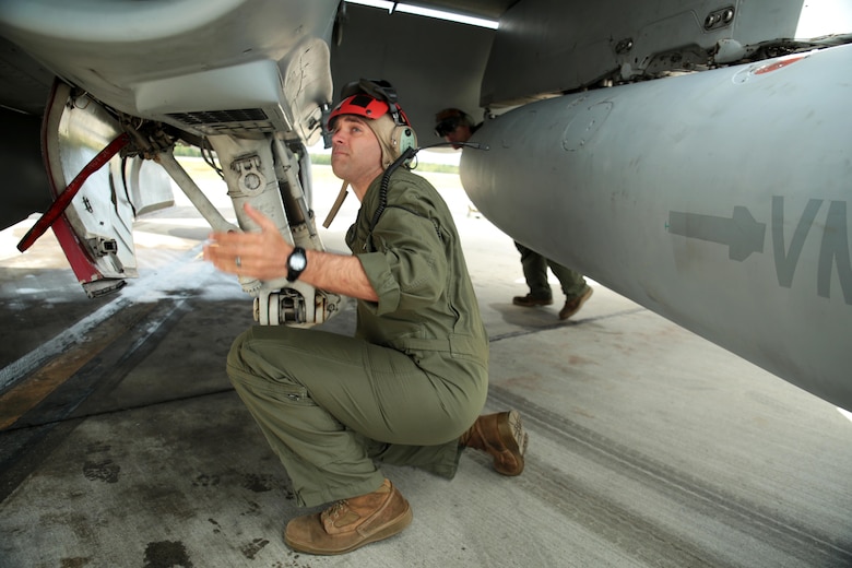 U.S. Marine Corps Sgt. Malcolm Cappelle, a quality assurance safety observer with Marine Fighter Attack Squadron (VMFA) 314, stationed at Marine Corps Air Station Miramar, California, and forward deployed to MCAS Iwakuni, Japan, inspects the undercarriage of an F/A-18C Hornet during exercise Red Flag-Alaska 16-2 at Eielson Air Force Base, Alaska, June 16, 2016. Cappelle is inspecting the jet to make sure everything is secured properly on the squadron’s fighter jet so it will be ready for the next mission during its support of exercise Red Flag-Alaska 16-2. (U.S. Marine Corps photo by Lance Cpl. Donato Maffin/Released)