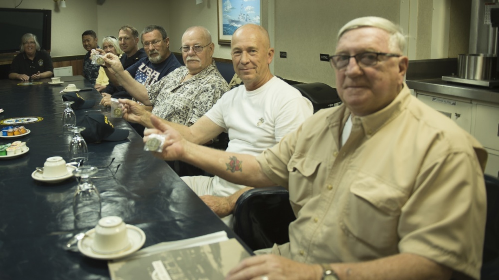 160617-N-IK388-019 (June 17, 2016) " (From Right) Dan Mulvihill, Bill Norman, Ray Hildreth, and Joe Kosoglow, Battle of Hill 488 Vietnam War survivors, pose with USS Howard commissioning coins during a tour of the guided-missile destroyer USS Howard (DDG 83). Howard hosted the tour to recognize the 50th anniversary of the June 15, 1966 battle. (U.S. Navy photo by Mass Communication Specialist 2nd Class Stacy M. Atkins Ricks/Released)