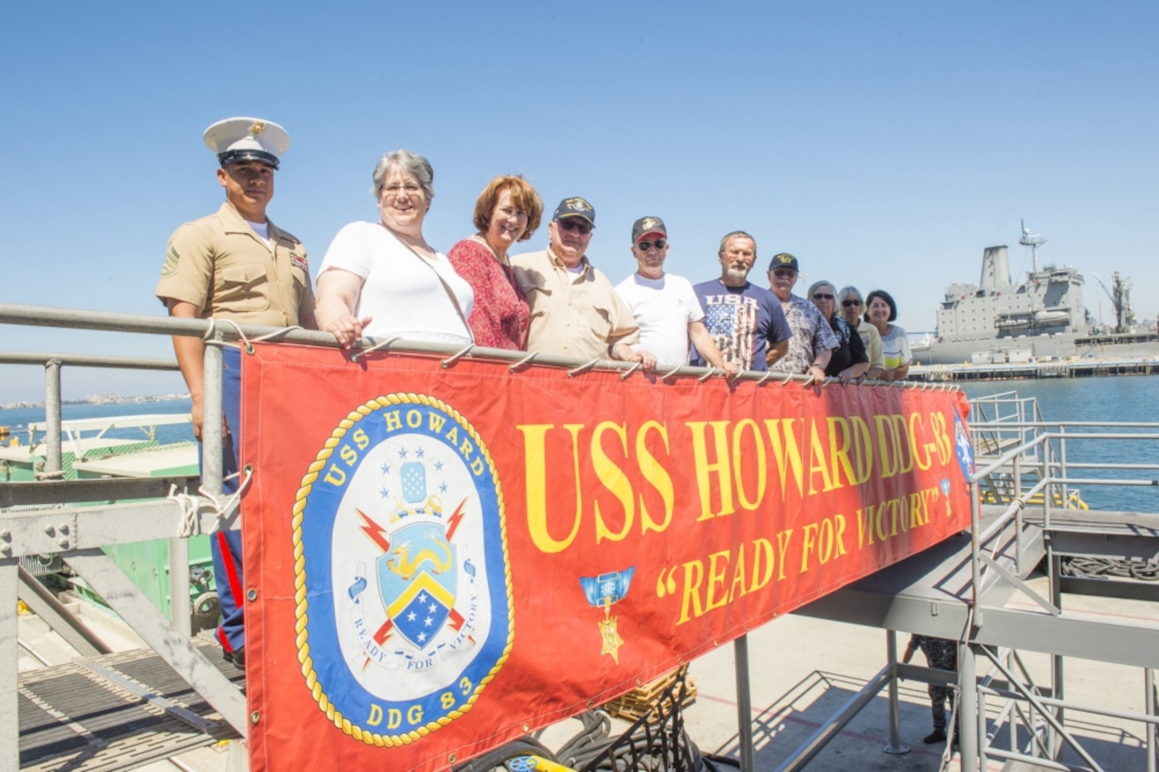 160617-N-IK388-074 (June 17, 2016) "Marine Corps veterans and Battle of Hill 488 Vietnam War survivors pose with the five daughters of 1st Sgt. Jimmie E. Howard, a Medal of Honor recipient of the Vietnam War and namesake of the guided-missile destroyer USS Howard (DDG 83), after a tour of the ship. Howard hosted the tour to recognize the 50th anniversary of the June 15, 1966 battle. (U.S. Navy photo by Mass Communication Specialist 2nd Class Stacy M. Atkins Ricks/Released)