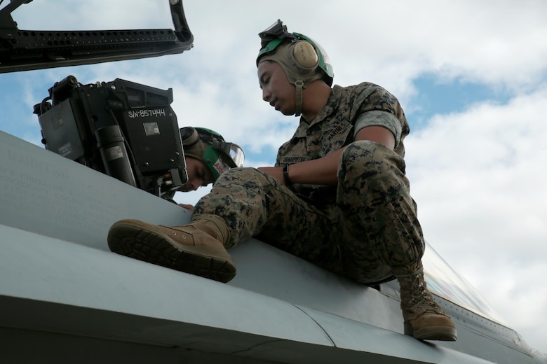U.S. Marine Corps Cpl. Harley Damarputra, an aviation life-support equipment technician and collateral duty inspector with Marine Fighter Attack Squadron (VMFA) 314, stationed at Marine Corps Air Station Miramar, California, forward deployed to MCAS Iwakuni, Japan, tests a seat in an F/A-18C Hornet during exercise Red Flag-Alaska 16-2 at Eielson Air Force Base, Alaska, June 16, 2016. Damarputra supports the squadron as a life-support equipment technician and collateral duty inspector by ensuring the pilots’ safety gear is working properly. (U.S. Marine Corps photo Lance Cpl. Donato Maffin/Released) 