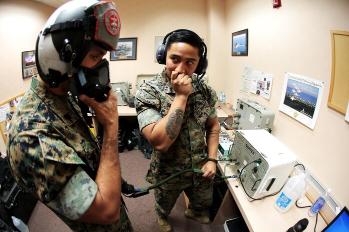 U.S. Marine Corps Cpl. Harley Damarputra, an aviation life-support equipment technician and collateral duty inspector with Marine Fighter Attack Squadron (VMFA) 314, stationed at Marine Corps Air Station Miramar, California, forward deployed to MCAS Iwakuni, Japan, checks the communication system in a pilot’s helmet during exercise Red Flag-Alaska 16-2 at Eielson Air Force Base, Alaska, June 16, 2016. Damarputra supports the squadron as a life-support equipment technician and collateral duty inspector by ensuring the pilots’ safety gear is working properly. (U.S. Marine Corps photo Lance Cpl. Donato Maffin/Released) 