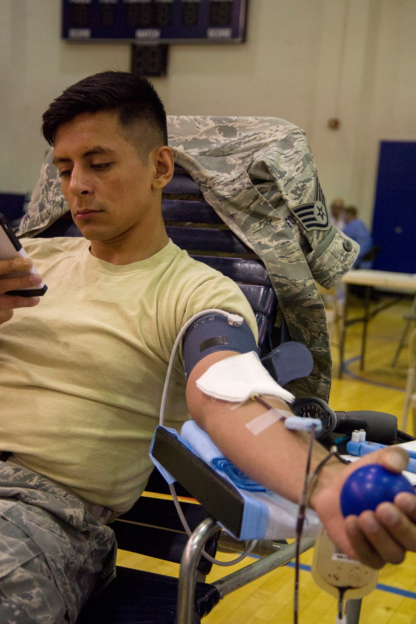 Staff Sgt. Oscar Chavez, 779th Medical Operations Squadron NCO in charge of outreach, donates blood for an Armed Services Blood Program blood drive at the East Fitness Center on Joint Base Andrews, Md., June 16, 2016. More than 30 people from JBA donated blood during the event. (U.S. Air Force photo by Airman Gabrielle Spalding)