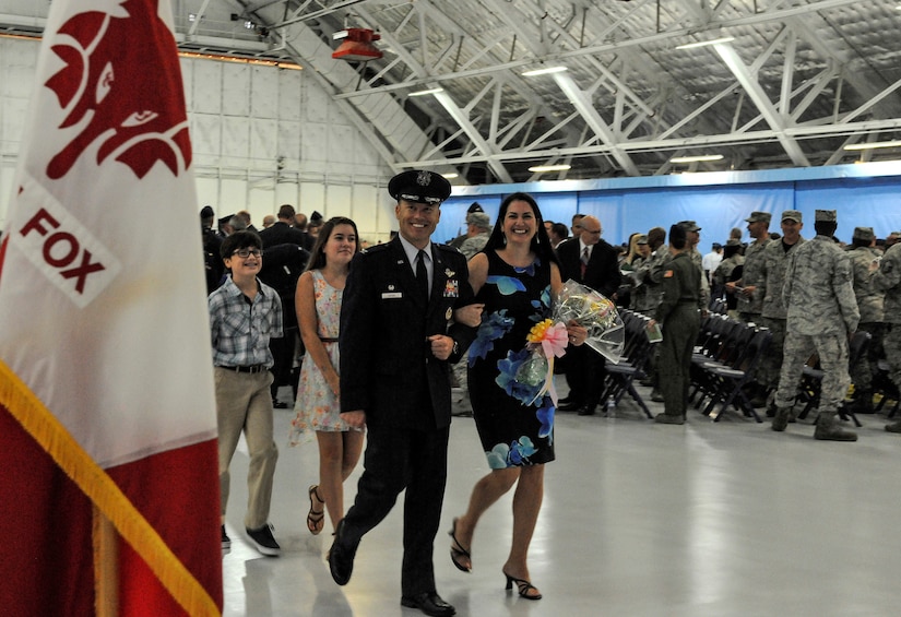 Col. Casey D. Eaton, 89th Airlift Wing commander, and his wife, Lisa, depart the 89th AW change-of-command ceremony, followed by their children Hannah and Seth, at Joint Base Andrews, Md., June 17, 2016. Col. John C. Millard relinquished command to Eaton, who will oversee the 89th AW, a combat-ready wing of more than 1,100 Airmen and provides Special Airlift Mission airlift and support to the president, vice president, cabinet members, combatant commanders and other senior military and elected leaders, supporting White House, Air Force chief of staff and Air Mobility Command missions. (U.S. Air Force photo by Senior Master Sgt. Kevin Wallace)