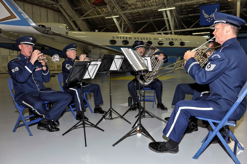 Air Force band members play arrival fanfare music as Lt. Gen. Samuel D. Cox, 18th Air Force commander; Col. John C. Millard, outgoing 89th Airlift Wing commander; and Col. Casey D. Eaton, 89th AW commander, arrive at the 89th AW change-of-command ceremony at Joint Base Andrews, Md., June 17, 2016. Col. John C. Millard relinquished command to Col. Casey D. Eaton, 89th Airlift Wing commander, who will oversee a combat-ready wing of more than 1,100 Airmen and provides Special Airlift Mission airlift and support to the president, vice president, cabinet members, combatant commanders and other senior military and elected leaders, supporting White House, Air Force chief of staff and Air Mobility Command missions. (U.S. Air Force photo by Senior Master Sgt. Kevin Wallace)