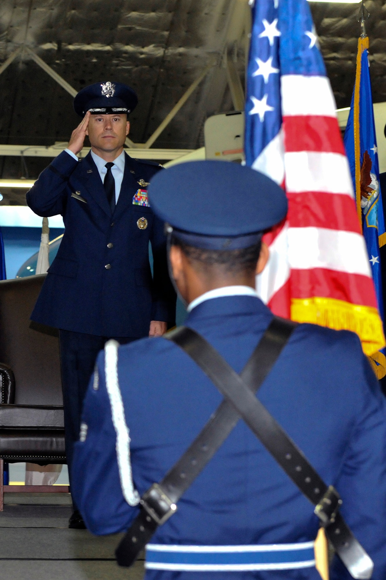 Col. Casey D. Eaton, 89th Airlift Wing commander, salutes during the playing of the National Anthem at the 89th AW change-of-command ceremony at Joint Base Andrews, Md., June 17, 2016. Col. John C. Millard relinquished command to Eaton, who will oversee the 89th AW, a combat-ready wing of more than 1,100 Airmen and provides Special Airlift Mission airlift and support to the president, vice president, cabinet members, combatant commanders and other senior military and elected leaders, supporting White House, Air Force chief of staff and Air Mobility Command missions. (U.S. Air Force photo by Senior Master Sgt. Kevin Wallace)