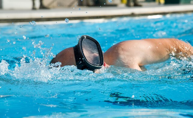 A Special Ops Challenge participant logs one of 10 laps during the 500-meter swim June 14, 2016, at the Oasis Pool on Dover Air Force Base, Del. Sixteen Team Dover members entered the challenge consisting of five events that challenged their speed and stamina. (U.S. Air Force photo/Roland Balik)