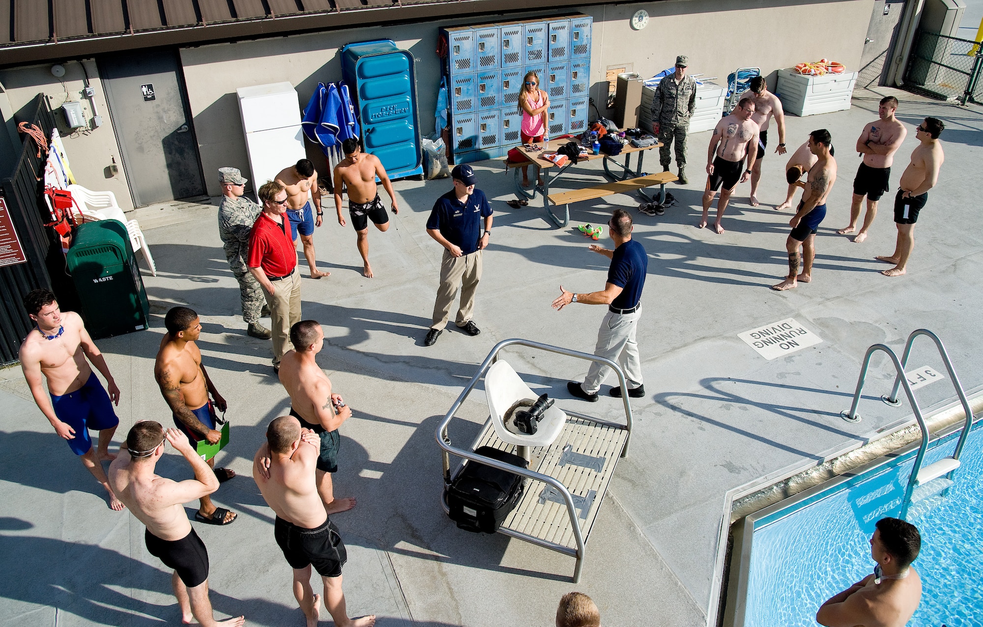 John Walters, 436th Force Support Squadron fitness program manager, center right, talks to Special Ops Challenge participants prior to the first event June 14, 2016, at the Oasis Pool on Dover Air Force Base, Del. Sixteen Team Dover members entered the challenge which consisted of five events; the first being a 500-meter swim. (U.S. Air Force photo/Roland Balik)