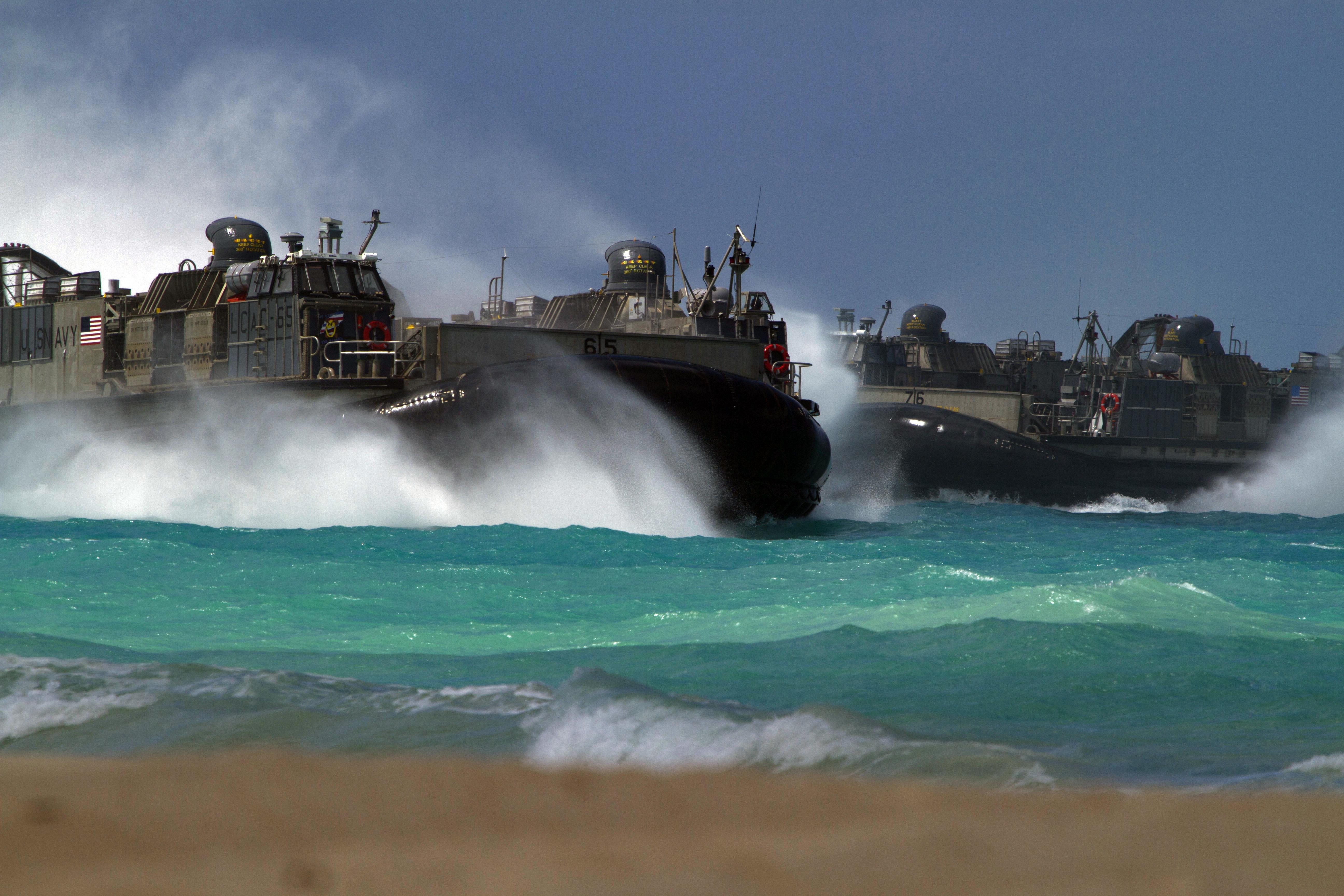 Foreign officers observe U.S. Marine Corps amphibious landing during