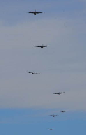 Multiple C-130s Hercules, assigned to the 29th Weapons Squadron, Little Rock Air Force Base, Arkansas, fly in formation over the Nevada Test and Training Range during the Joint Forcible Entry Exercise portion of the United States Air Force Weapons School Advanced Integration, June 16, 2016. U.S. Air Force warfighters joined their Army partners from the 82nd Airborne for in airdrops over the Nevada Test and Training Range June 18, as part of the JFEX. (U.S. Air Force photo by Airman 1st Class Kevin Tanenbaum)