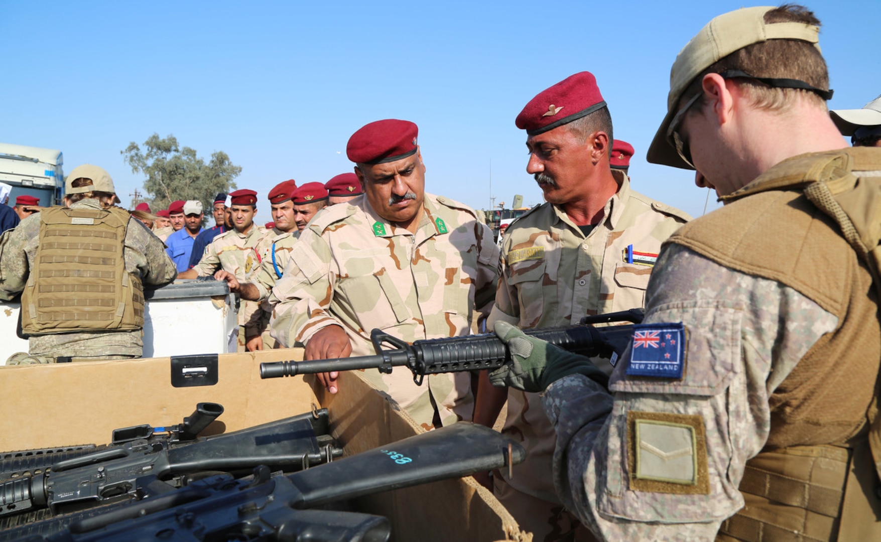 A New Zealand soldier with Task Group Taji, confirms a serial number on an M16 rifle during the distribution of equipment purchased through the Iraqi Train and Equip Fund at Camp Taji, Iraq, earlier this year. (U.S. Army photo by Sgt. Kalie Jones)