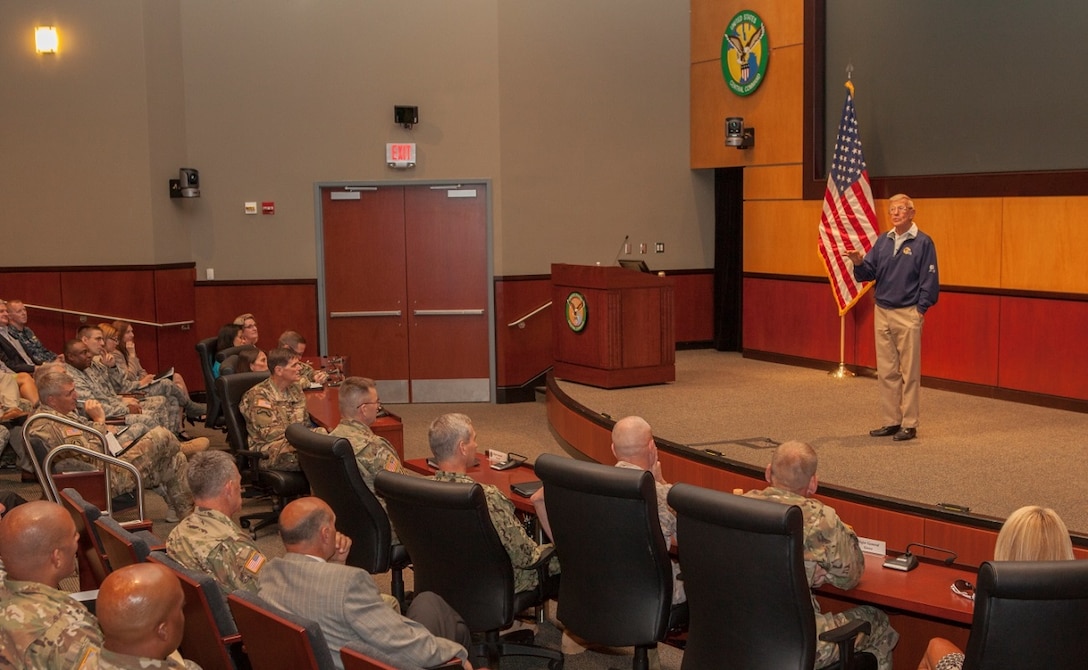 Retired Hall of Fame football coach Lou Holtz gives a motivational speech to service members assigned to U.S. Central Command. Holtz, 79, achieved notoriety for his time coaching at the University of Notre Dame and the University of South Carolina. (CENTCOM photo by Sgt. Jordan Belser)
