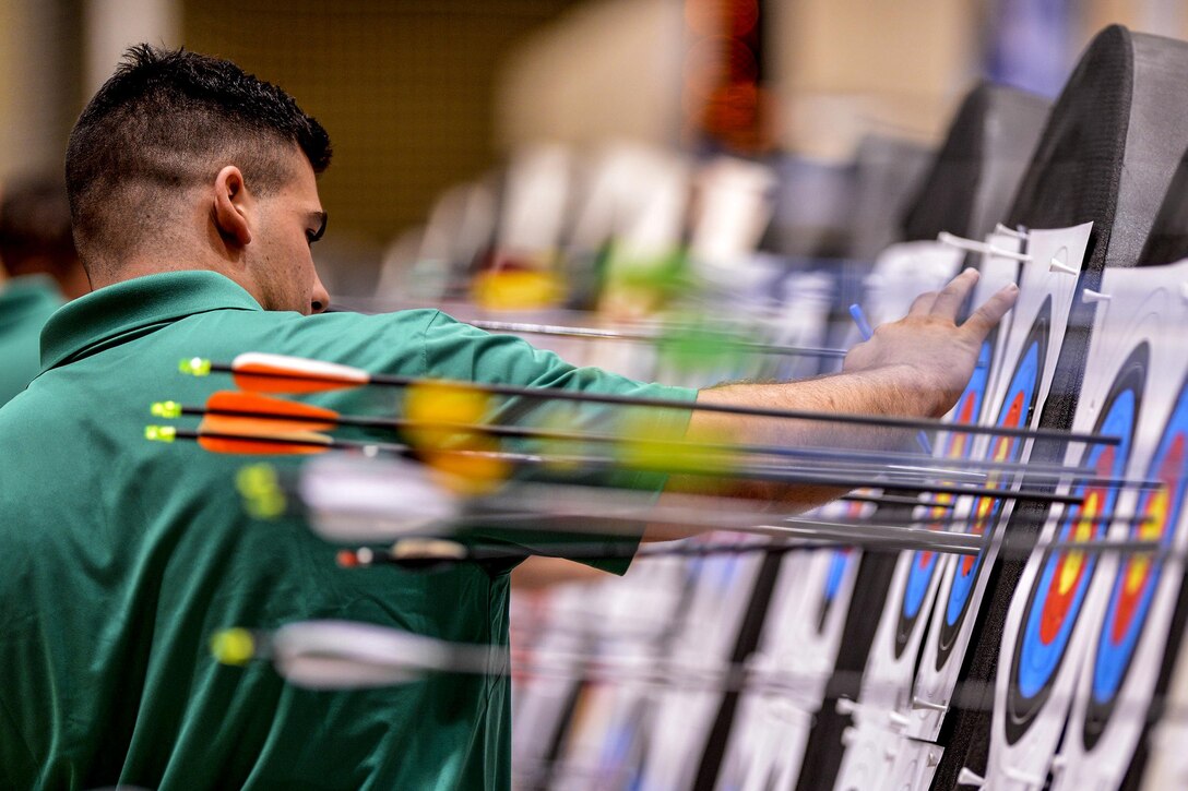 A referee judges targets during the the archery competition at the 2016 Department of Defense Warrior Games at the U.S. Military Academy in West Point, N.Y., June 17, 2016. The event is an adaptive sports competition for wounded, ill and injured service members, and veterans who compete in archery, cycling, track and field, shooting, sitting volleyball, swimming and wheelchair basketball. Air Force Photo by Staff Sgt. Carlin Leslie