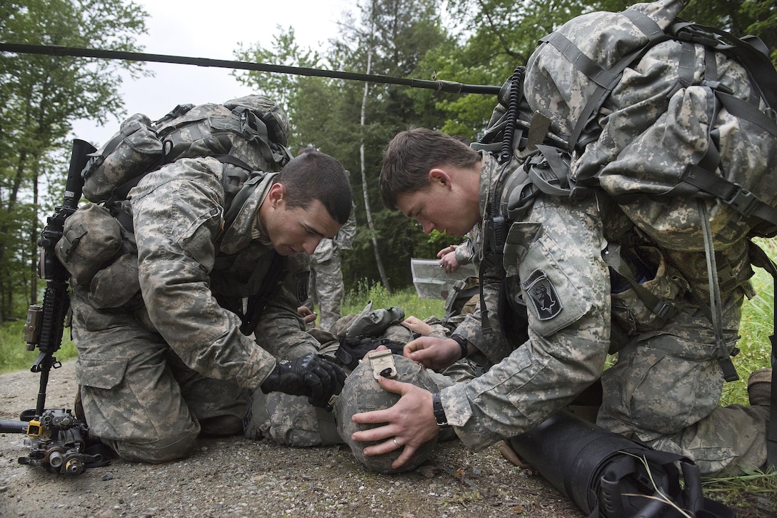 Army Pfc. Troy Anger and Army Spc. Michael Capen treat a simulated wounded patient during a casualty assessment and evacuation exercise at Camp Ethan Allen Training Site in Jericho, Vt., June 12, 2016. Anger and Capen are medics assigned to the Vermont National Guard’s Company A, 3rd Battalion, 172nd Infantry Regiment, 86th Infantry Brigade Combat Team. Air National Guard photo by Tech. Sgt. Sarah Mattison