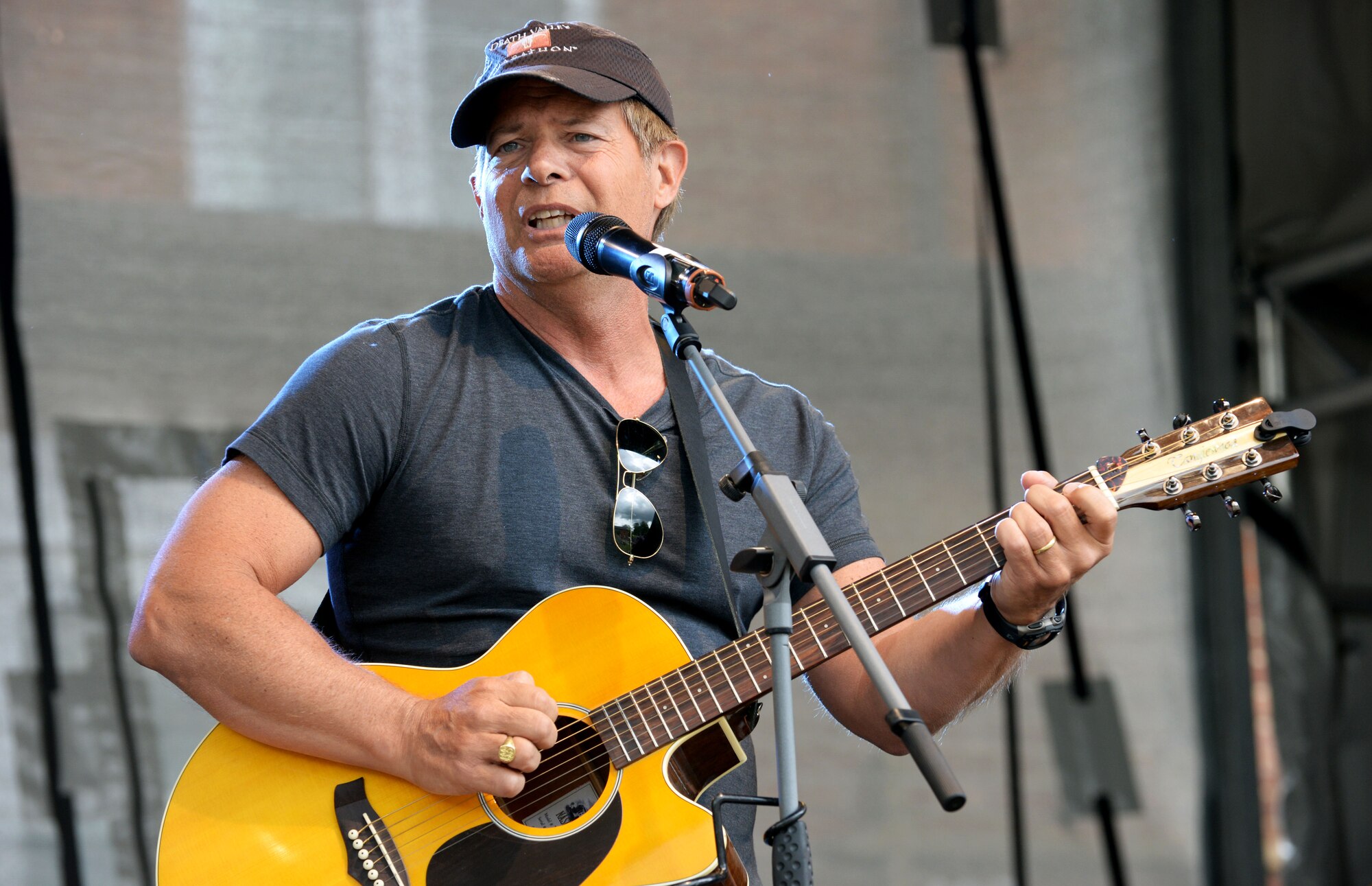 Guy Jaquier, country music singer-songwriter, performs for Team Mildenhall Airmen during the Marauder Melee event June 16, 2016, on RAF Mildenhall, England. Jaquier opened the stage with his original song about air-refueling. The concert was open to all base ID card holders and their dependents. (U.S. Air Force photo by Airman 1st Class Tenley Long/Released)