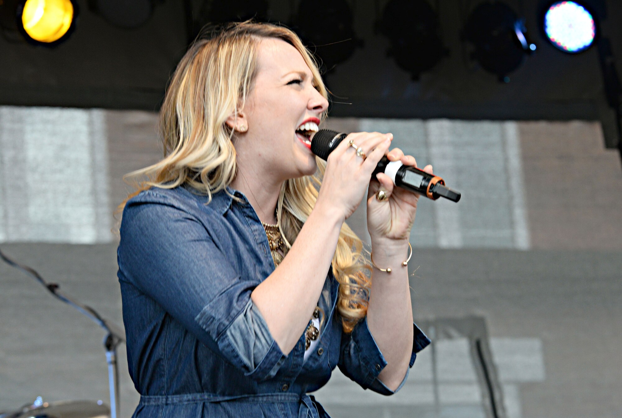 Toree McGee, country music singer-songwriter, performs for Team Mildenhall Airmen during the Marauder Melee event June 16, 2016, on RAF Mildenhall, England. This was McGee’s debut performance in the U.K. The concert was open to all base ID holders and their dependents. (U.S. Air Force photo by Airman 1st Class Tenley Long/Released)