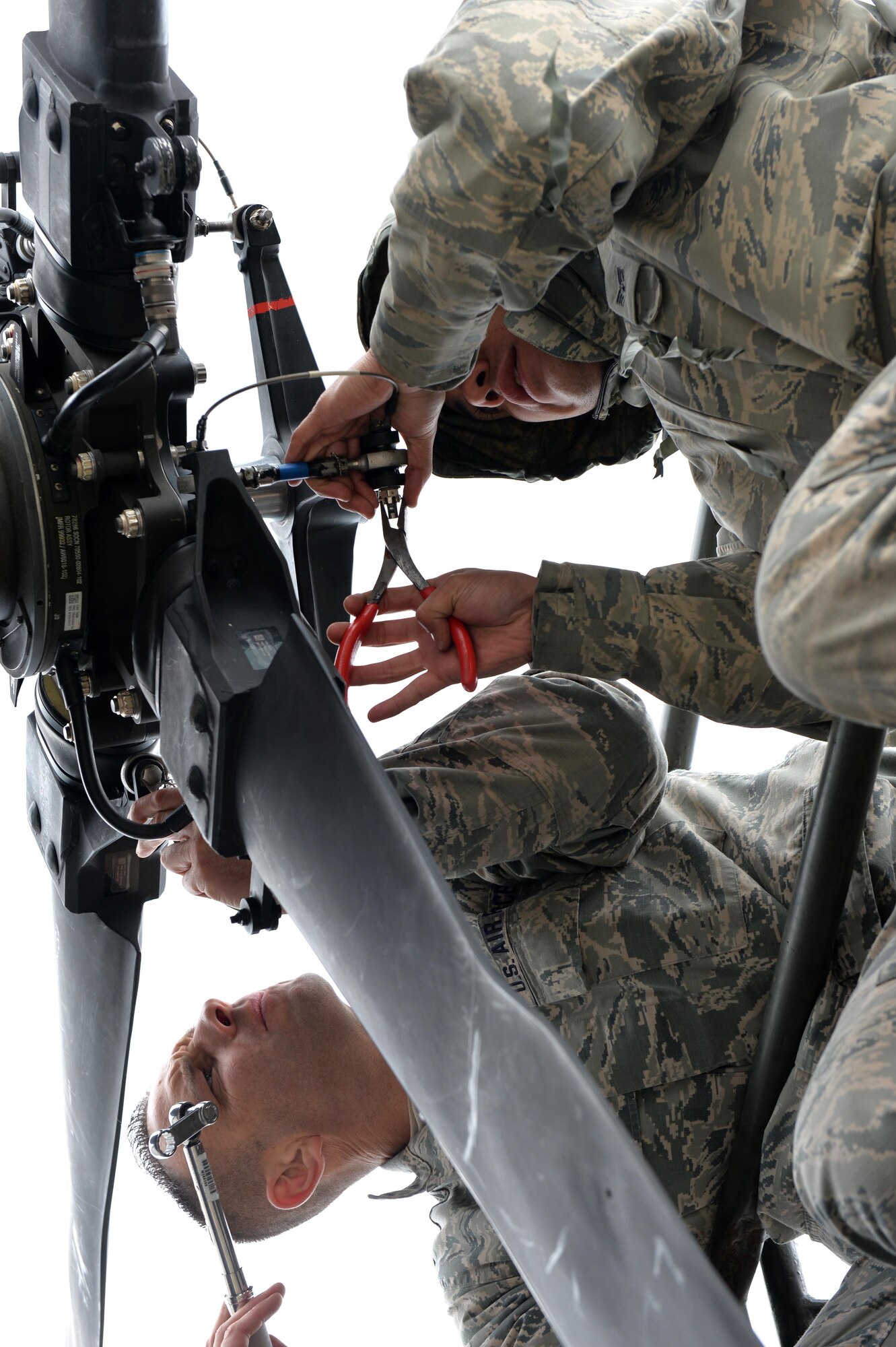 Air Force Master Sgt. Scott Hnetinka and Senior Airman Steven Vargas, 106th Maintenance Group, assemble a tail rotor June 11, 2016 at Amari Air Base, Estonia during the unfolding of a U.S. Air Force HH-60 Pave Hawk helicopter as part of Saber Strike 16. Saber Strike is a multinational exercise that tests the capabilities of various aspects of the militaries involved. (U.S. Air National Guard photo/Staff Sgt. Blake Mize/released)