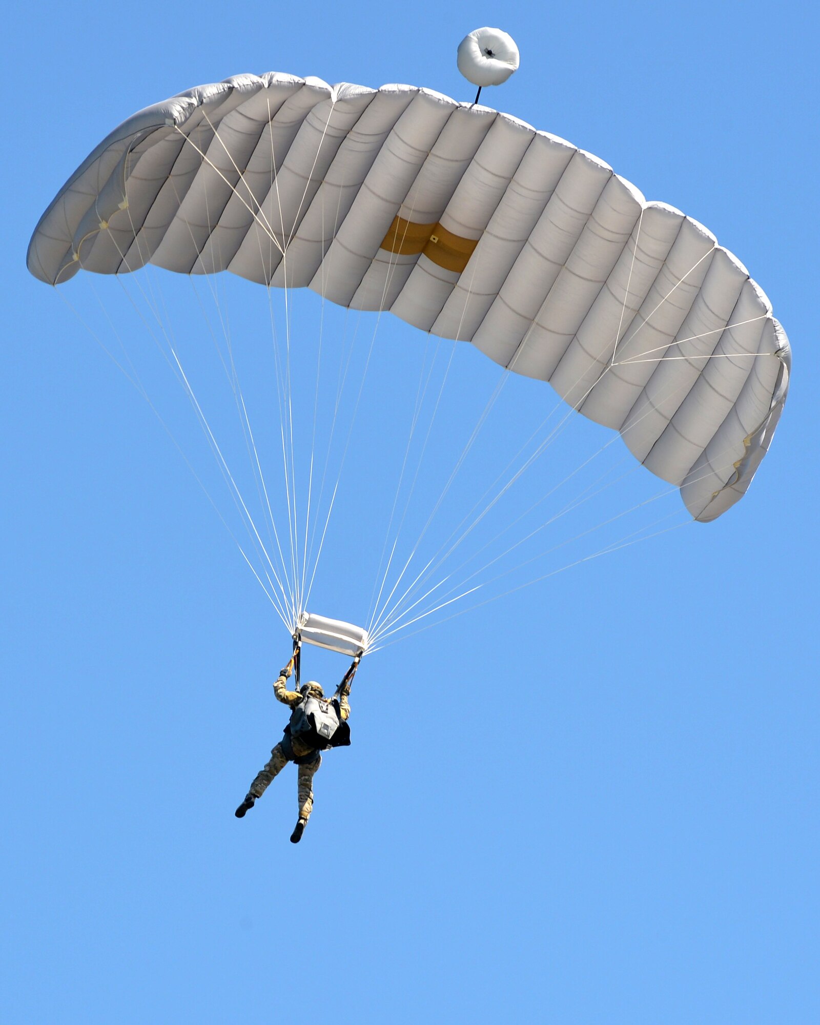 Senior Airman John Kosequat, 103rd Rescue Squadron Red Team Senior NCOIC, parachutes into the drop zone during a pararescue training jump at Amari Air Base, June 12, 2016 at Amari Air Base, Estonia as part of Saber Strike 16. Saber Strike is a multinational exercise that tests the capabilities of various aspects of the militaries involved. (U.S. Air National Guard photo/SSgt Blake Mize/released)