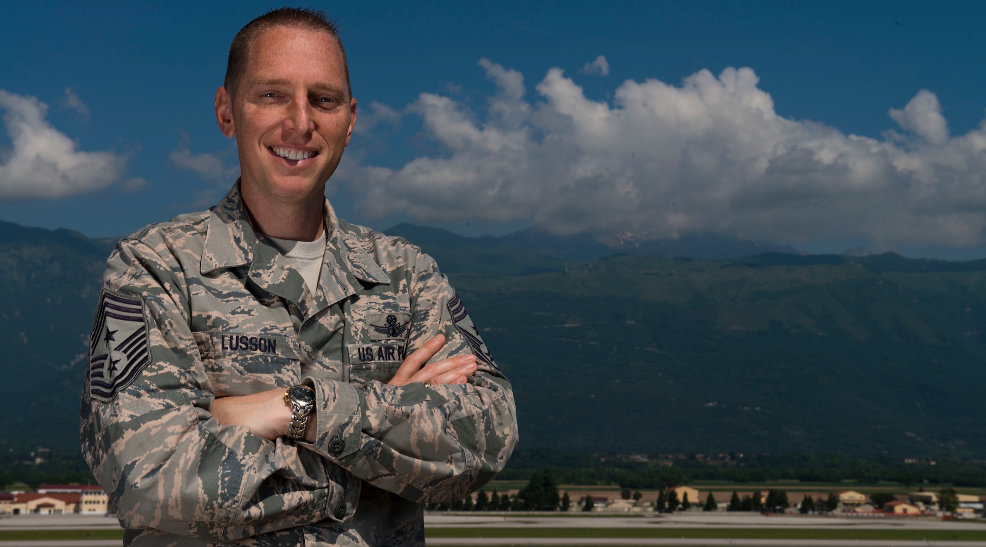 Command Chief Master Sgt. Matt Lusson, 31st Fighter Wing command chief, poses in front of Monte Cavallo, June 7, 2016, at Aviano Air Base, Italy. Chief Lusson’s biggest wishes while at Aviano are to spend time on-the-job with Airmen, promote professional development and ensure Team Aviano can take the time off they deserve. (U.S. Air Force photo by Senior Airman Austin Harvill/Released)