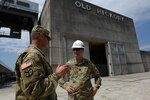 Maj. Gen. Jeffrey H. Holmes, deputy adjutant general for the Tennessee National Guard, and Lt. Col. Stephen Murphy, U.S. Army Corps of Engineers Nashville District commander, confer June 20, 2016 during a security assistance exercise where soldiers set up a perimeter to protect the Old Hickory Dam Power House and switchyard and ensured only authorized personnel gained entry into the facility located in Hendersonville, Tenn. 