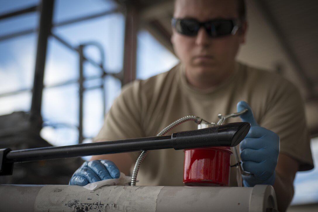 Staff Sgt. Jamie Weum, 31st Maintenance Squadron aerospace ground equipment craftsman, services a tow bar June 20, 2016, at Aviano Air Base, Italy. The 31st MXS AGE Airmen are directly responsible for maintaining and repairing the equipment used by the 724th Air Mobility Squadron, which supports 510th and 555th Fighter Squadron operations. (U.S. Air Force photo by Airman 1st Class Cory W. Bush/Released)
