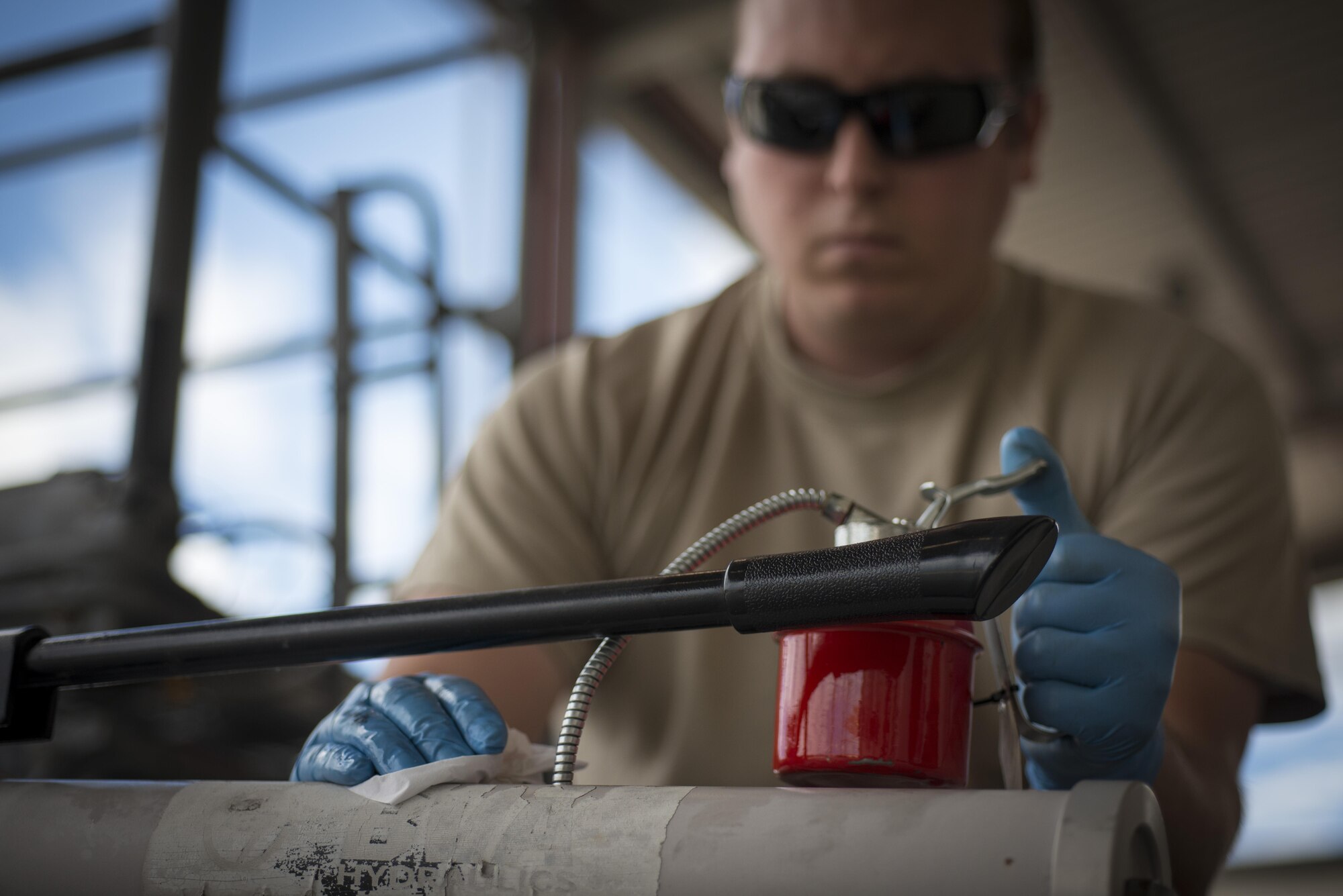 Staff Sgt. Jamie Weum, 31st Maintenance Squadron aerospace ground equipment craftsman, services a tow bar June 20, 2016, at Aviano Air Base, Italy. The 31st MXS AGE Airmen are directly responsible for maintaining and repairing the equipment used by the 724th Air Mobility Squadron, which supports 510th and 555th Fighter Squadron operations. (U.S. Air Force photo by Airman 1st Class Cory W. Bush/Released)