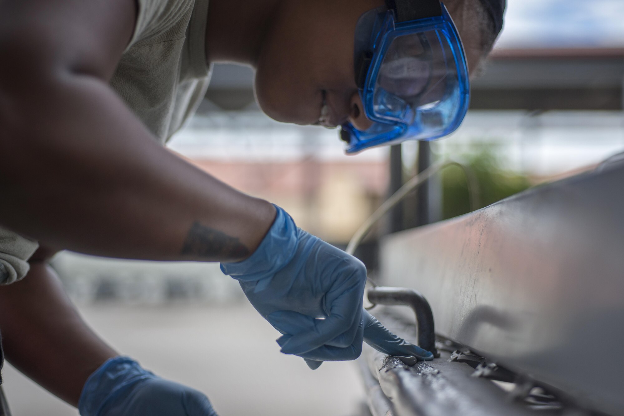 Senior Airman Dejahnay Truesdale, 31st Maintenance Squadron aerospace ground equipment journeyman, fixes the bumper pad on a maintenance stand June 20, 2016, at Aviano Air Base, Italy. The bumper pad wraps around the edge of the stand to ensure it does not damage an aircraft when maintenance is performed. (U.S. Air Force photo by Airman 1st Class Cory W. Bush/Released)