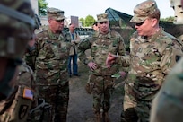 From left to right: Lt. Gen. Ben Hodges, U.S. Army Europe Commanding General, Brig. Gen. Greg Mosser, 364th Expeditionary Sustainment Command Commanding General, and Maj. Gen. Duane Gamble, 21st Theater Sustainment Command Commanding General, are welcomed by Col. William Stubbs, 30th Medical Brigade Commander, to the 30th MB headquarters in Warsaw, Poland on June 9.