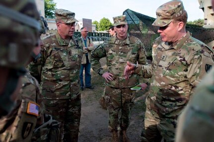 From left to right: Lt. Gen. Ben Hodges, U.S. Army Europe Commanding General, Brig. Gen. Greg Mosser, 364th Expeditionary Sustainment Command Commanding General, and Maj. Gen. Duane Gamble, 21st Theater Sustainment Command Commanding General, are welcomed by Col. William Stubbs, 30th Medical Brigade Commander, to the 30th MB headquarters in Warsaw, Poland on June 9.