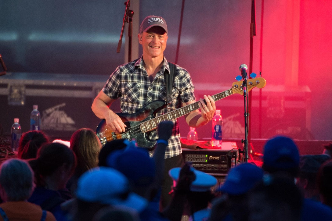 Actor and musician Gary Sinese plays bass guitar with his band, the Lt. Dan Band, during the closing ceremony for the 2016 Department of Defense Warrior Games at the U.S. Military Academy in West Point, N.Y., June 21, 2016. DoD photo by EJ Hersom