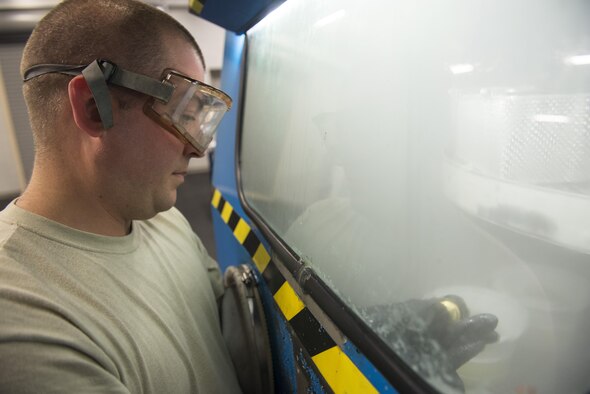 Staff Sgt. Mark Gower, 33rd Maintenance Squadron wheel and tire technician, washes F-35 wheel parts in a parts washer June 9, 2016, at Eglin Air Force Base, Fla. Members of the 33rd MXS Wheel and Tire Shop use the parts washer to clean break dust and old grease off of wheel assemblies to prepare them for a new tire and wheel bearing, ensuring proper tire function. (U.S. Air Force photo by Senior Airman Stormy Archer/Released)