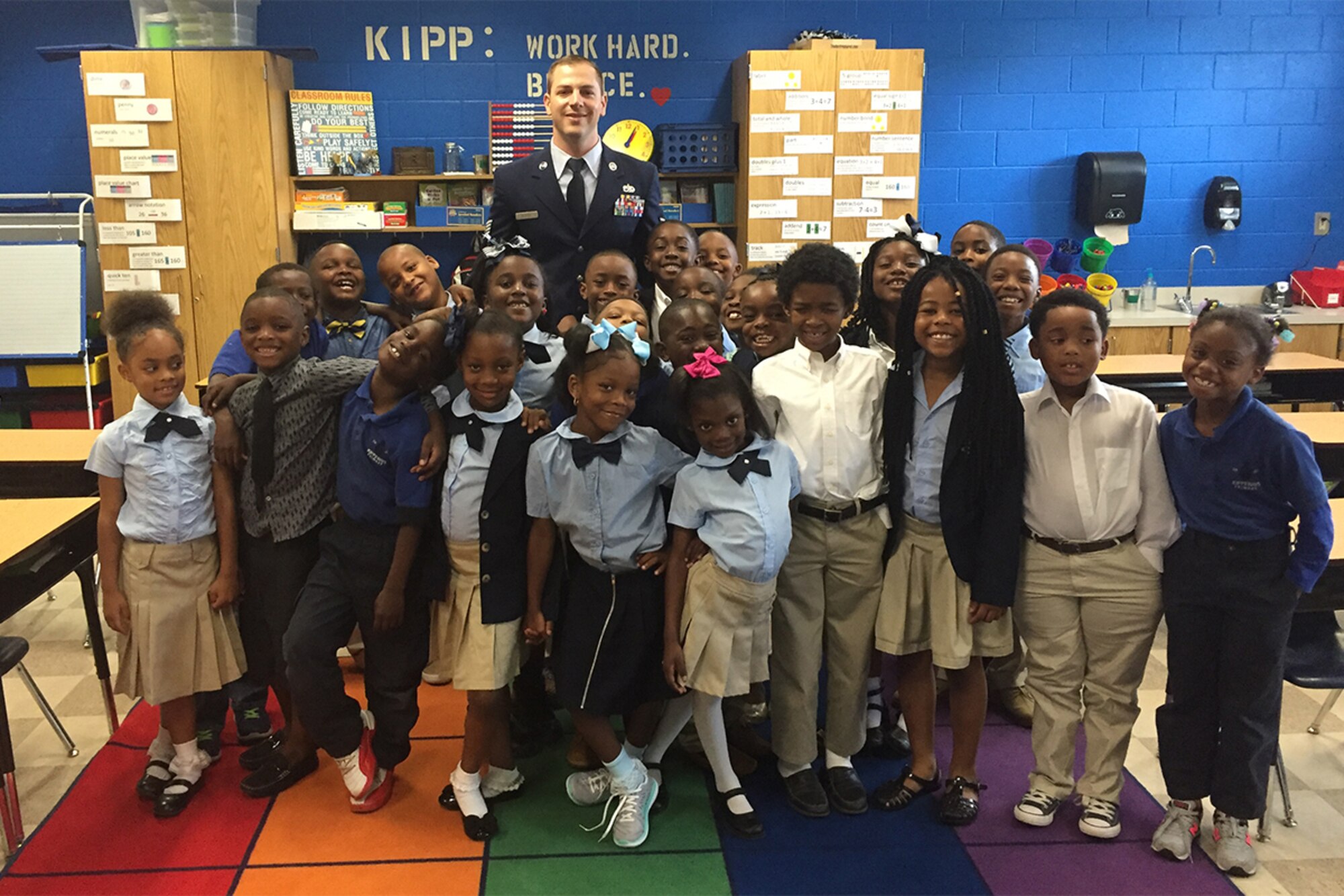 Staff Sgt. Alexander Blench, 80th Aerial Port Squadron air transportation specialist, attends the KIPP WAYS Academy, Atlanta, Georgia, first grade graduation ceremony on May 17, 2016. Blench served as a classroom volunteer tutoring students in grammar and math while transitioning from active duty into the Air Force Reserve. KIPP WAYS Academy is a free, public charter school that grants admission to students in the Atlanta Public Schools District, regardless of their prior academic records, conduct or social-economic background. (Courtesy photo)