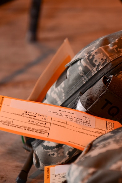 An inspection card is placed on a joint first aid kit (JFAK) at Al Udeid Air Base, Qatar, June 15, 2016. The JFAK is scheduled to replace the formally-used individual first aid kits (IFAK) that are carried by deployed individuals for use in emergency situations. (U.S. Air Force photo by Senior Airman Kimberly Nagle)