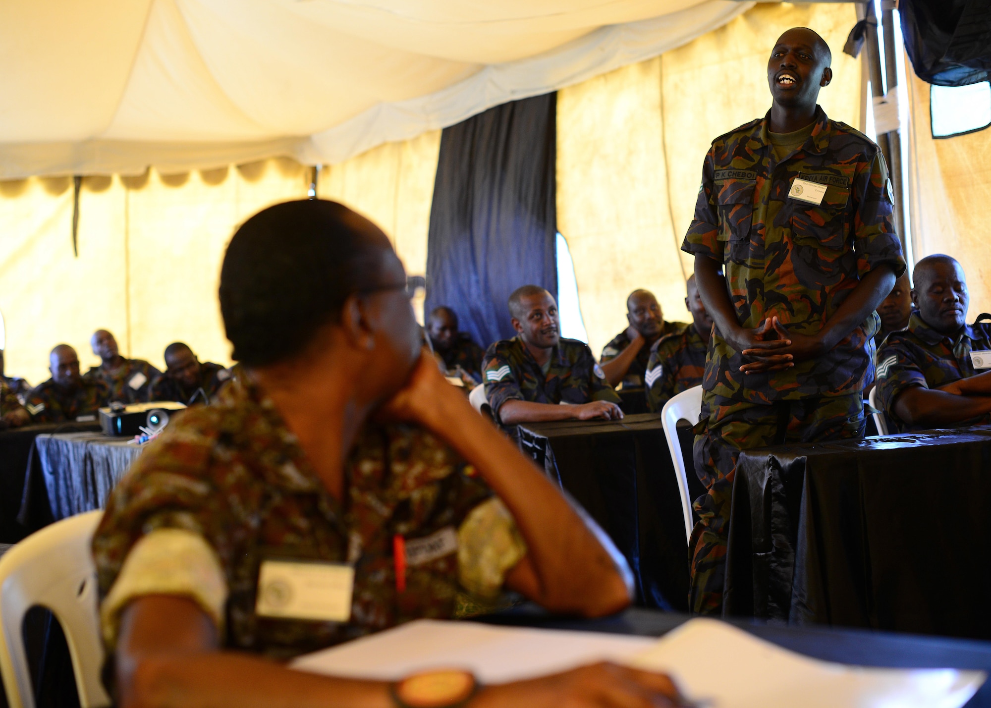 A Kenyan airman introduces himself during classroom training for African Partnership Flight Kenya at Laikipia Air Base, Kenya, June 20, 2016. More than 50 U.S. Air Force Airmen participated in the first African Partnership Flight in Kenya. The APF is designed for U.S. and African partner nations to work together in a learning environment to help build expertise and professional knowledge and skills. (U.S. Air Force photo by Tech. Sgt. Evelyn Chavez/Released)