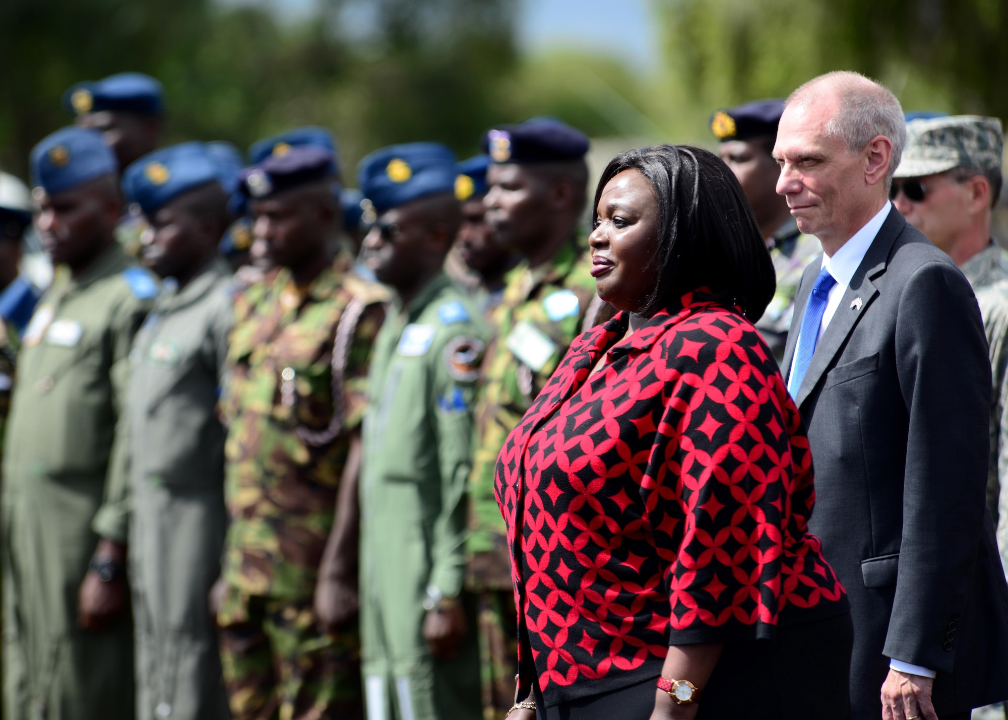 (From left) Raychelle Omamo, Kenyan Cabinet Secretary for Defense and Robert Godec, U.S. Ambassador to Kenya, welcome African Partnership Flight participants during the opening ceremony at Laikipia Air Base, Kenya, June 21, 2016. More than 50 U.S. Air Force Airmen participated in the first African Partnership Flight in Kenya. The APF is designed for U.S. and African partner nations to work together in a learning environment to help build expertise and professional knowledge and skills. (U.S. Air Force photo by Tech. Sgt. Evelyn Chavez/Released)