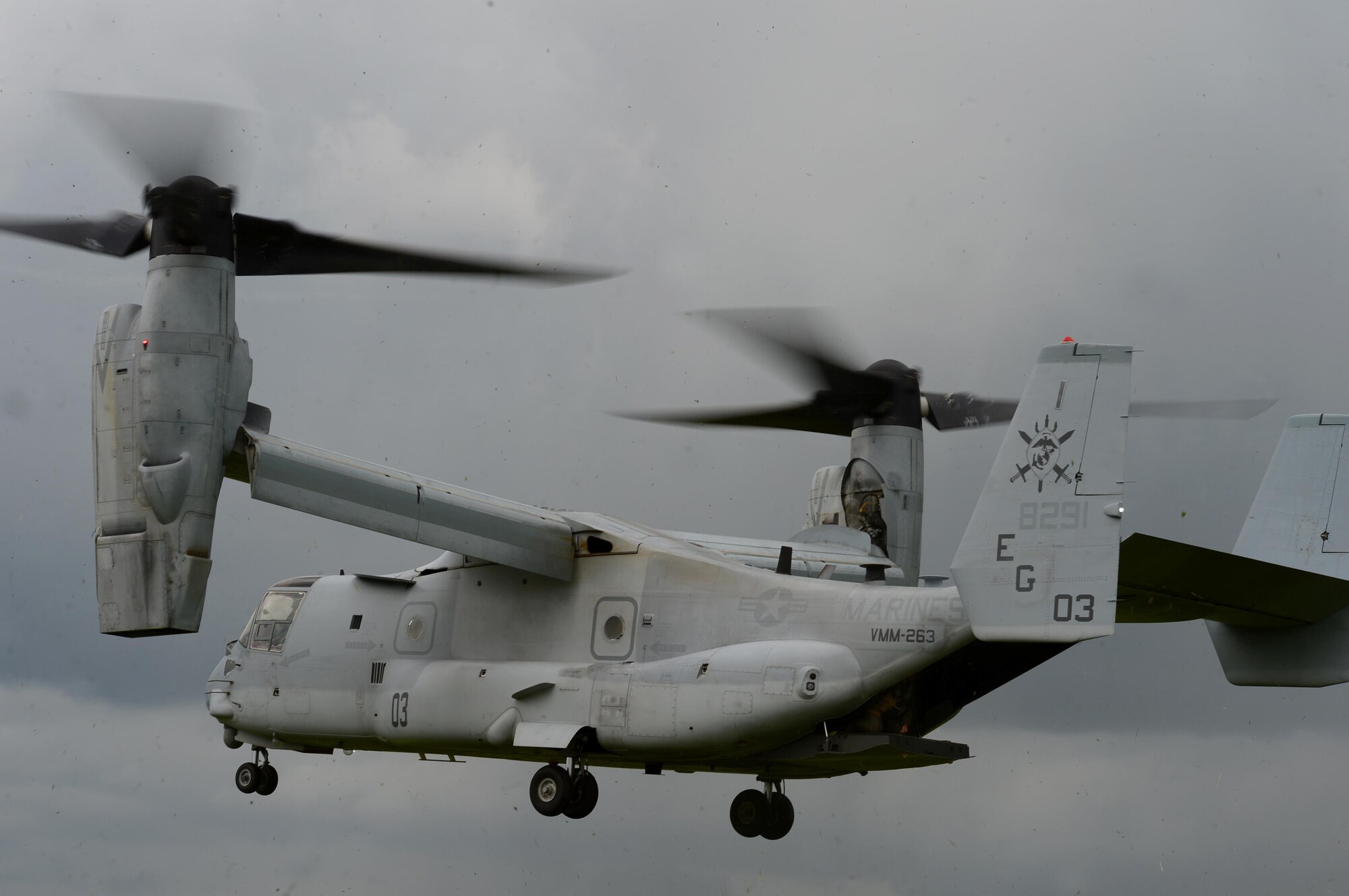 A U.S. Marine Corps MV-22 Osprey prepares to land at Stanford Training Area, England, June 14. U.S. Marines and Sailors, along with U.S. Air Force pararescuemen, participated in a joint exercise to enhance interoperability and to acquire various medical and evacuation techniques through realistic application. (U.S. Air Force photo/Senior Airman Erin Trower)