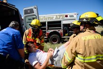 First responders tend to a victim during a base exercise, Opinicus Vista 16-2, at Schriever Air Force Base Colorado, Wednesday, June 15, 2016. Base personnel acted as victims during a tornado scenario. (U.S. Air Force photo/Christopher DeWitt)