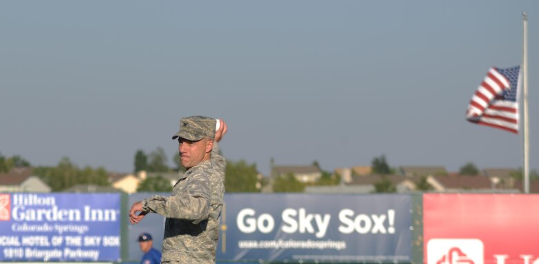 Col. Stephen Slade, Individual Mobilization Augmentee to the 50th Space Wing commander, throws the cermonial first pitch before the Colorado Springs Sky Sox military appreciation night in Colorado Springs, Colorado, Thursday, June 16, 2016. Slade was among a handful of guests who received the honor prior to the game’s start.(U.S. Air Force photo/Airman William Tracy)