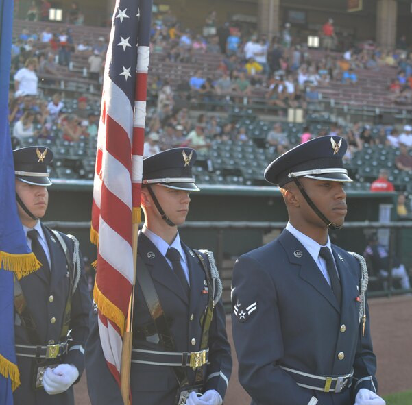 The High Frontier Honor Guard prepares to present the colors during pre-game festivities at the Colorado Springs Sky Sox military appreciation night in Colorado Springs, Colorado, Thursday, June 16, 2016. The honor guard is composed of Airmen from Cheyenne Mountain Air Force Station, Peterson AFB and Schriever Air Force Bases. (U.S Air Force photo/Airman William Tracy)