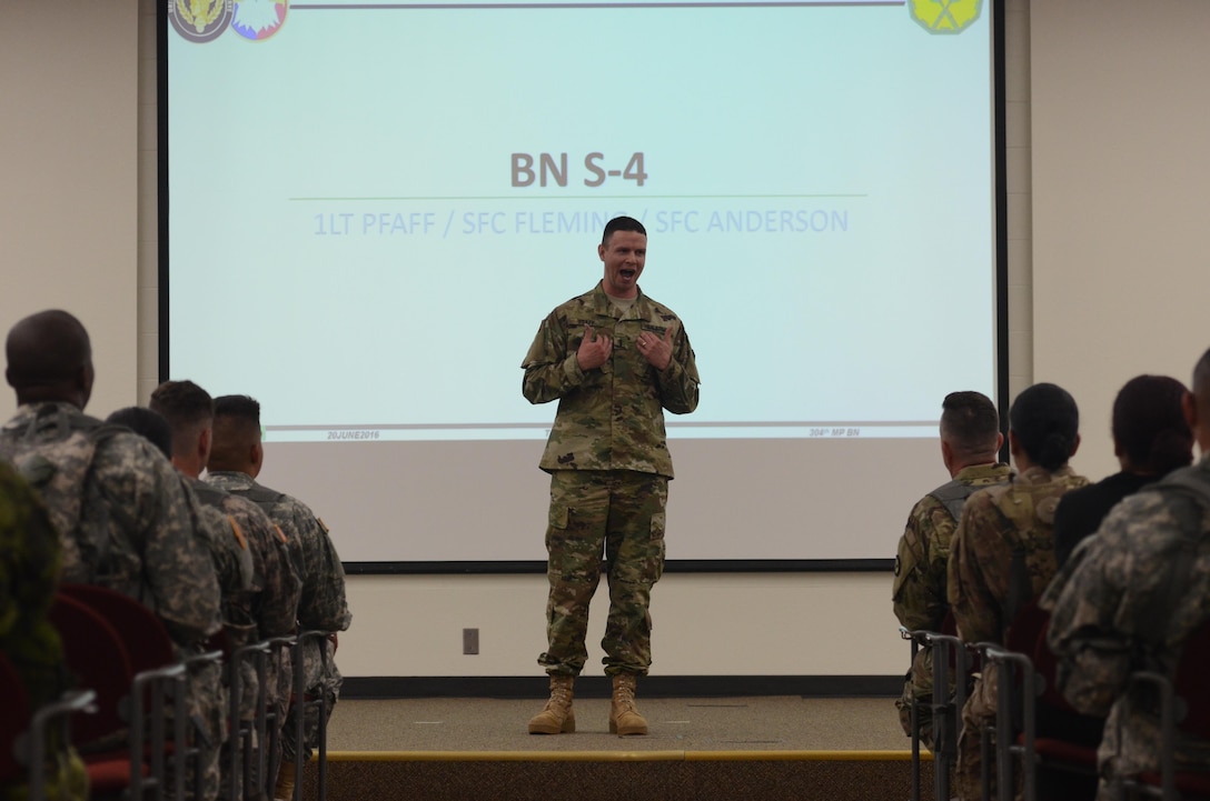 1st. Lt. Erik Pfaff, U.S. Army Reserve logistics officer for the 304th Military Police Battalion, speaks to approximately 200 U.S. Army Reserve and Canadian military police Soldiers at a briefing on exercise Guardian Justice at Fort McCoy, Wisc., June 20, 2016. Guardian Justice is a military police exercise that focuses on detention operations and combat support. (U.S. Army photo by Spc. Adam Parent)