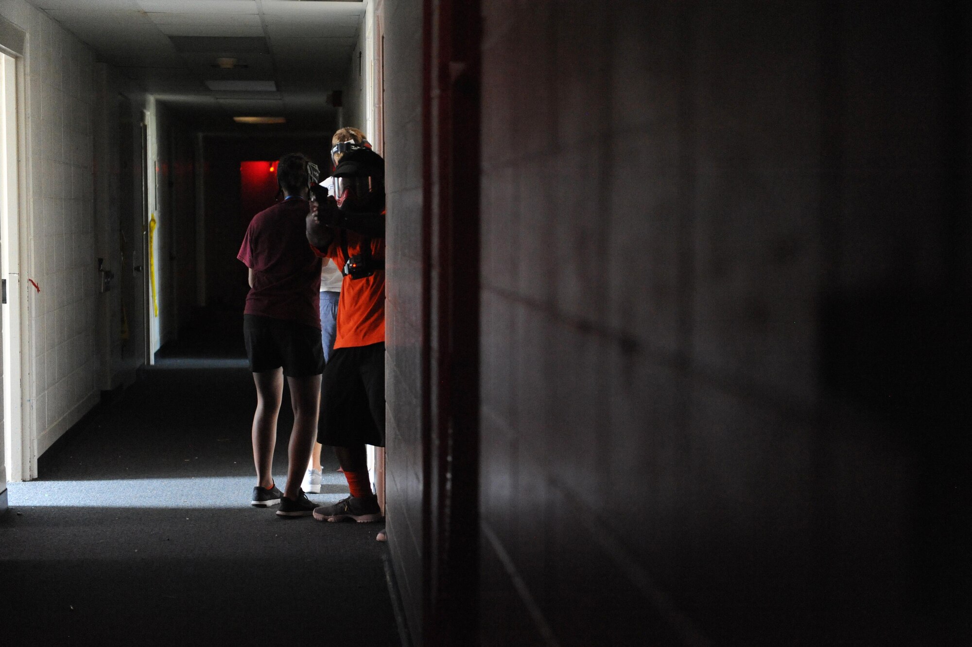 Junior ROTC cadets conduct an active shooter training session with local police officers at the Locker House during the Southeastern Law Enforcement Explorers Academy June 17, 2016, Keesler Air Force Base, Miss. The academy offers adolescents the opportunity to gain experience, knowledge, and learn skills necessary to apply for future careers in law enforcement. (U.S. Air Force Photo by Kemberly Groue)