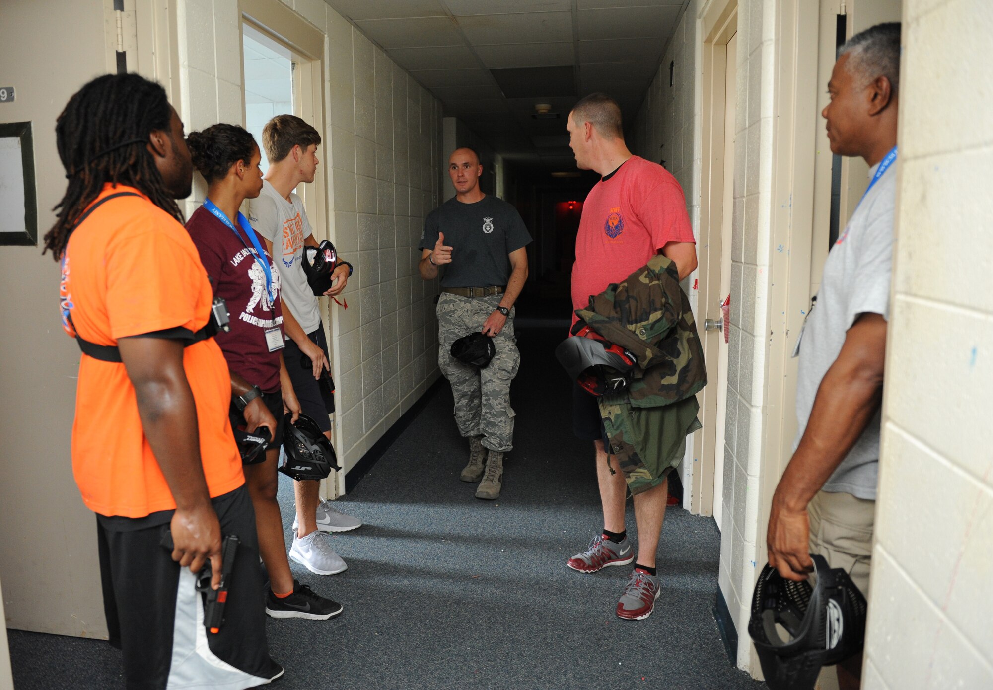 Capt. Harlan Glinski, 81st Security Forces Squadron operations officer, reviews an active shooter training session scenario with Junior ROTC cadets and local police officers at the Locker House during the Southeastern Law Enforcement Explorers Academy June 17, 2016, Keesler Air Force Base, Miss. The academy offers adolescents the opportunity to gain experience, knowledge, and learn skills necessary to apply for future careers in law enforcement. (U.S. Air Force Photo by Kemberly Groue)