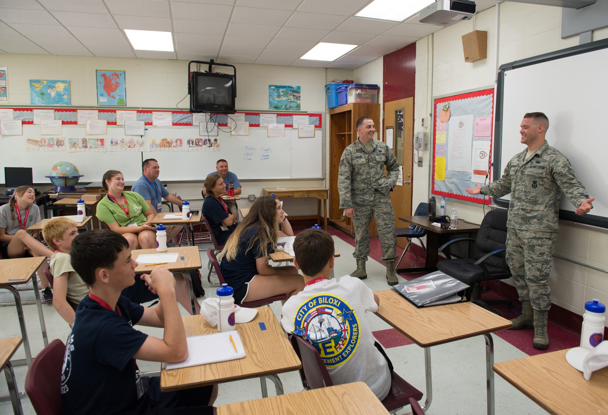 Staff Sgt. Brian Fossum, 81st Security Forces Squadron physical security officer, and Senior Airman Jonathan Arceneaux, 81st SFS visitor center officer, speak to Junior ROTC cadets about their chosen career fields at the Southeastern Law Enforcement Explorers Academy held at Biloxi Junior High School June 17, 2016, Biloxi, Miss. The academy offers adolescents the opportunity to gain experience, knowledge, and learn skills necessary to apply for future careers in law enforcement. (U.S. Air Force Photo by Marie Floyd)