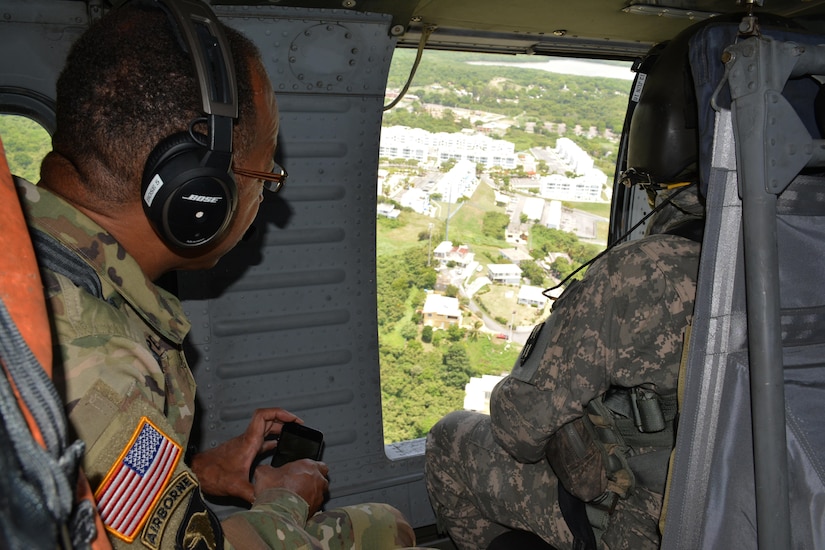 Maj. Gen. A.C. Roper, commander of the 80th Training Command, observes the Puerto Rican landscape from a UH-60 Black Hawk helicopter during a visit to Puerto Rico and St. Croix, March, 10, 2016. During his visit, Roper met with the National Guard adjuvants general of the two islands to discuss the ongoing relationship between the National Guard and 5th Brigade 94th Training Division, an 80th TC subordinate unit.