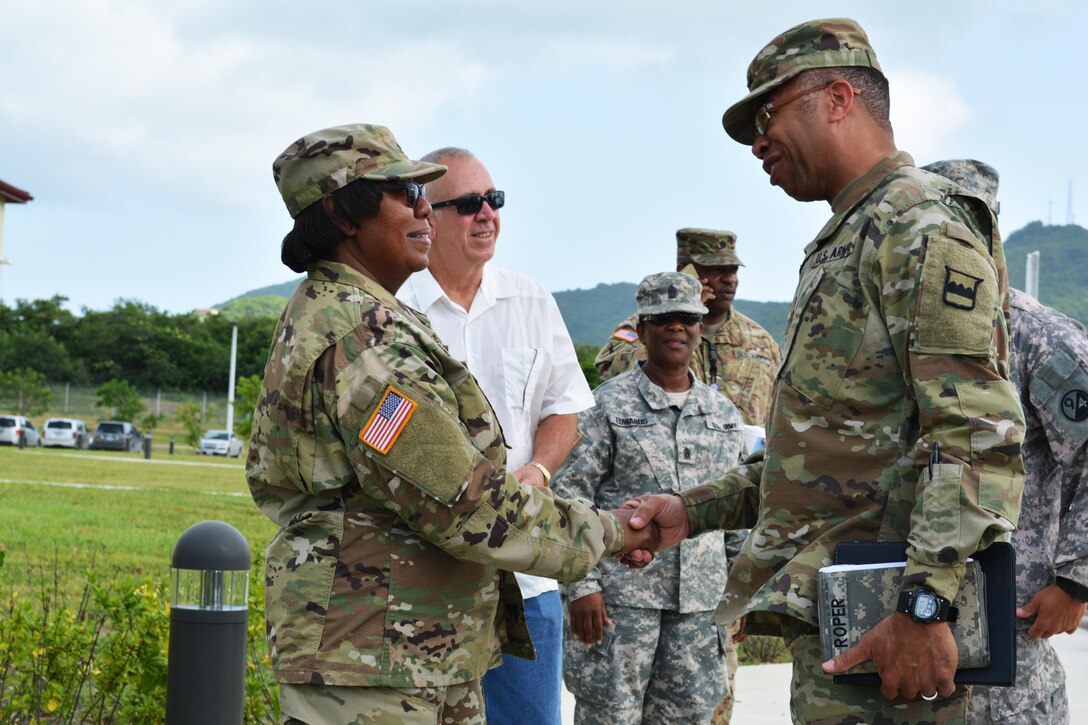 Maj. Gen. Deborah Y. Howell, the adjutant general of the Virgin Islands National Guard, greets Maj. Gen. A.C. Roper, commander of the 80th Training Command, in St. Croix, U.S. Virgin Islands, March 10, 2016. Roper met with Howell to discuss the ongoing relationship between the Puerto Rico National Guard and 5th Brigade 94th Training Division, an 80th TC subordinate unit.