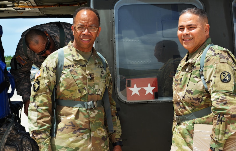 Maj. Gen. A.C. Roper, commander 80th Training Command, and the senior noncommissioned officer of 5th Brigade 94th Training Division, Command Sgt. Maj. Javier FigueroaNunez, prepare to board a UH-60 Black Hawk helicopter from St. Croix U.S. Virgin Islands to Puerto Rico March 10, 2016. During his visit to St. Croix, Roper met with Maj. Gen. Deborah Y. Howell, the adjutant general of the Virgin Islands National Guard. The two general officers discussed the relationship between 5th Brigade and the National Guard in the Virgin Islands.