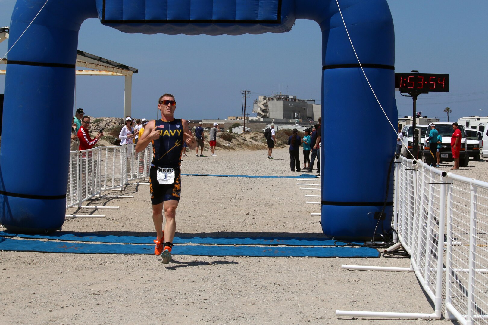 Navy Lt. Kyle Hooker of NAS Jacksonville, Fla. won his second straight Armed Forces individual gold medal and led Navy to team silver.  The 2016 Armed Forces Triathlon Championship was held at Naval Base Ventura County, Calif. on 18 June.  