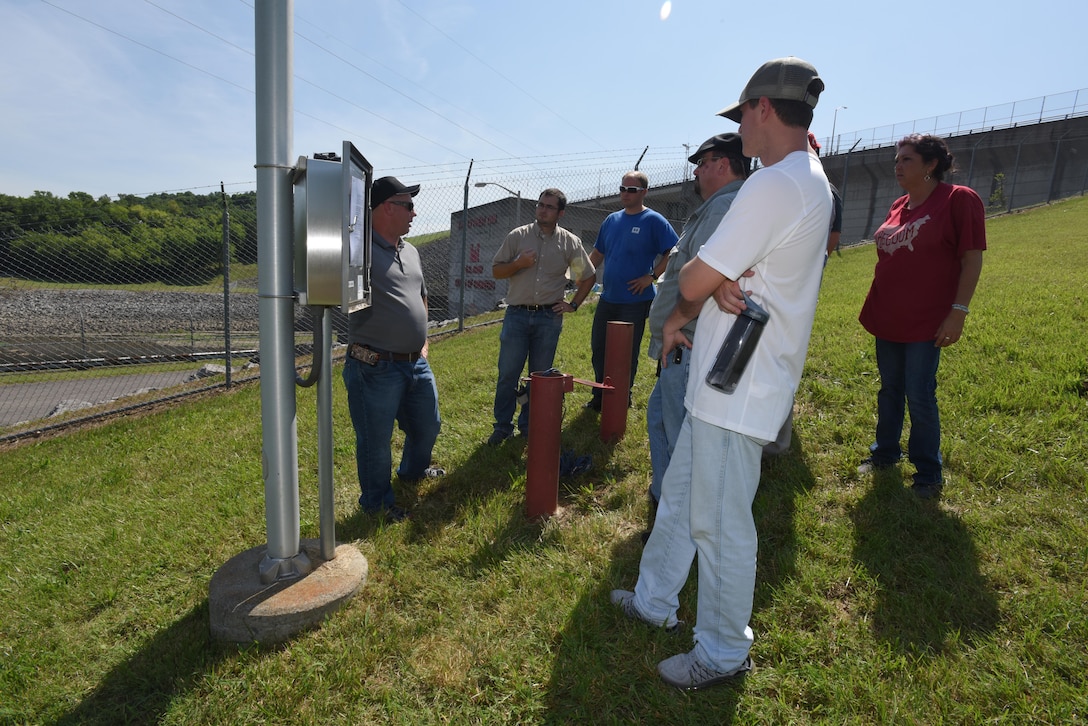 Jason Anderson, U.S. Army Corps of Engineers St. Louis District, shows students the automated instrumentation installed at J. Percy Priest Dam in Nashville, Tenn., during a hands-on class June 16, 2016.