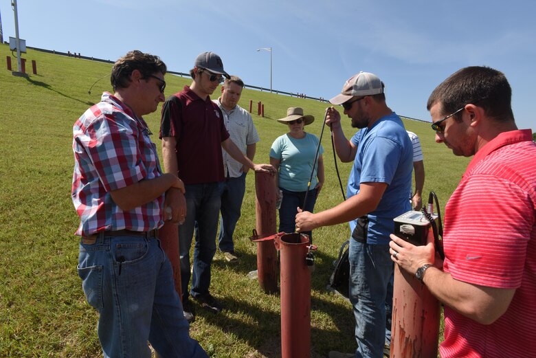 Matthew Short, U.S. Army Corps of Engineers Nashville District instrumentation technician, shows students how to take manual inclinometer readings at J. Percy Priest Dam June 16, 2016. Inclinometers are used to measure any slope movement. 