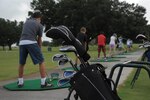 Children practice their golf swings at the Randolph Oak Golf Course driving range during the Junior Golf Camp, June 14, 2016, at Joint Base San Antonio-Randolph. Thirty-six children, ages 7 to 14, took four days of lessons from volunteer instructors and played a few holes on the course on the last day of the camp. 